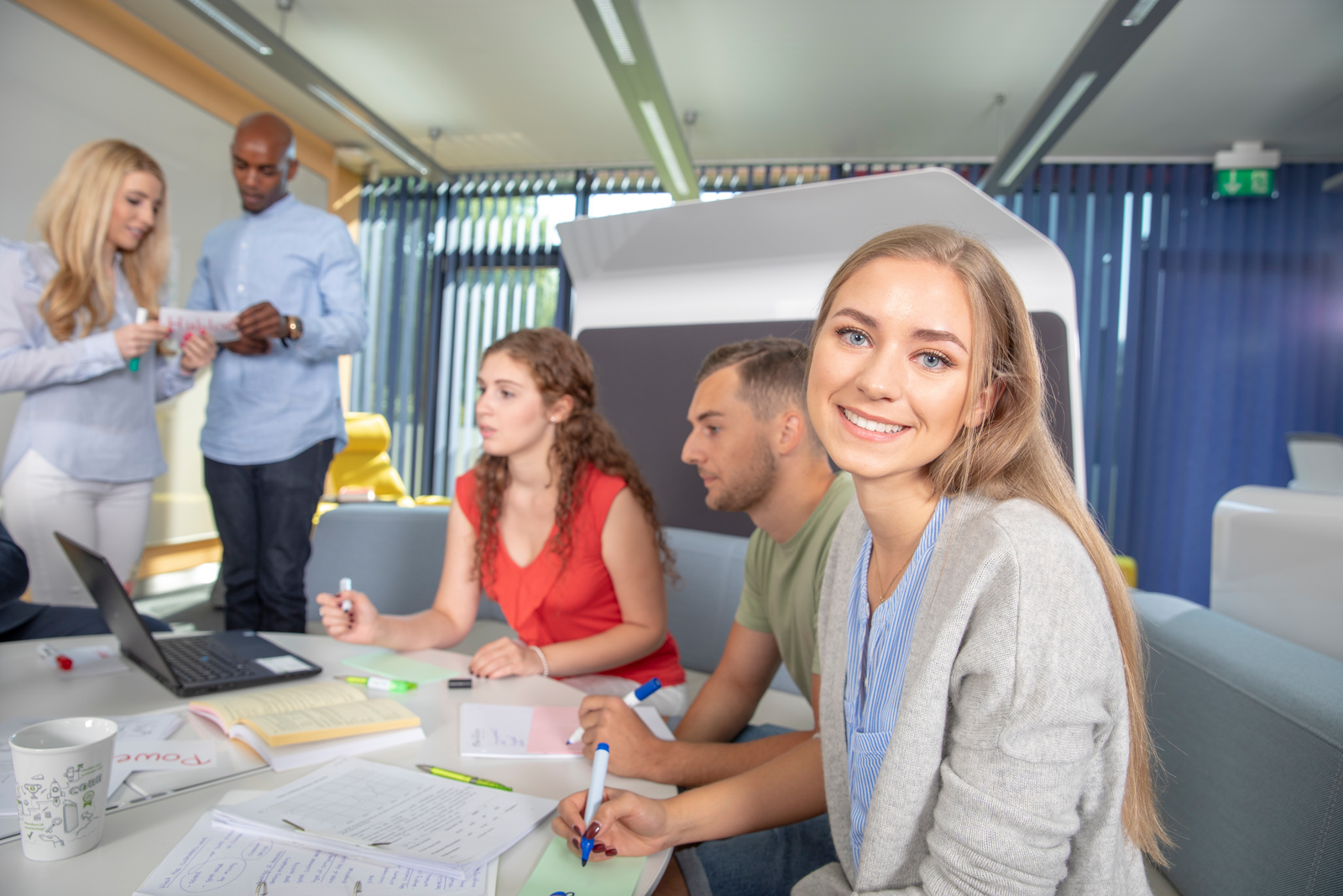 Student looks into the camera.