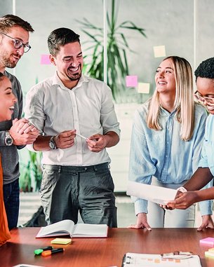 Students collaboratively develop a study project at their desks.